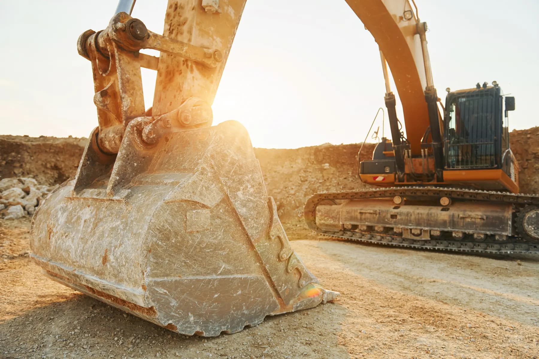 Close-up of an excavator bucket at a construction site